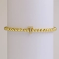 Golden beaded bracelet featuring a micro-pave 18k gold plated T-letter charm with white zircons - Letter T