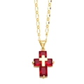 Macro detail of a gold cross pendant with four rectangular red cubic zirconia stones - Red Zirconia / Red
