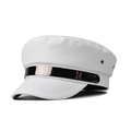 Detailed macro view of white textured leather navy cap with a golden M metal buckle - White
