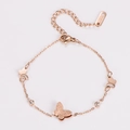 Close-up of rose gold butterfly bracelet with pavé crystals and stainless steel logo tag - Rose Gold