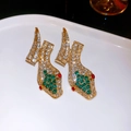 Detailed shot of vintage gold snake earrings with sparkling white and green rhinestones - Gold Multicolor Rhinestone Snake Style (2#)