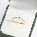 Macro shot of 18k gold plated brass letter D ring with diamonds in a green velvet box - D Gold