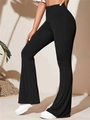 Detailed macro view of black ribbed knit flared high-waist yoga pants with elastic fabric - S / Bottoms / Black