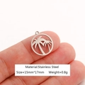 Silver stainless steel coconut tree pendant 15x17mm shown held for scale - Palm Tree-DY1083-1