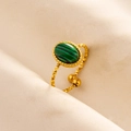Detailed close-up of adjustable gold ring featuring an oval green malachite stone and faceted band - Gold Base-Malachite Green Stone