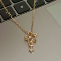 Golden star pendant necklace with clear crystals and fine link chain on metallic surface - Gold Double Rhinestone Hollow Star Style (WG-0867)
