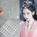 Iridescent aurora face gems with teardrop fringe for festival makeup and dance - Iridescent Meteor forehead Gem