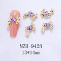 Detail van gouden strik nageldecoraties met paarse hartvormige strassteentjes, 13x14mm - Gouden Strikje Roze Paars Hart(9428)