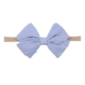 Detailed view of lavender purple bow headband with textured fabric on soft nylon band - Lavender