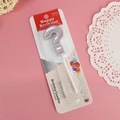 Retail packaging detail of a silver question mark shaped birthday cake candle topper - Silver