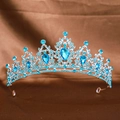 Silver bridal crown featuring blue crystals and teardrop gemstone on brown background - Silver Lake Blue