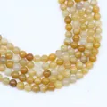Detailed top view of natural yellow agate stone beads for DIY jewelry and accessory making - Yellow Aventurine / 4mm (approximately 90 Beads) 38cm Long