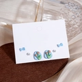 Chic earring set featuring blue bows, elegant pearls, and floral tulip designs - Blue Bow Tulip Pearl Studs 3-Pair Set