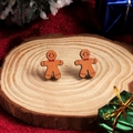 Festive gingerbread man earrings with red bow on natural wood base for Christmas - Gingerbread Man