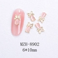 Detalle de dijes para uñas mariposa 3D con ópalo rosa y tamaño 6x10mm, modelo MZH-8902 - Estilo Mariposa Dorada Ojo de Gato Rosa (8902)