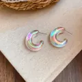 Iridescent acrylic U-shaped hoop earrings with colorful pearlescent finish on beige fabric - AB Color