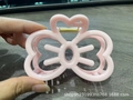 Pink bow-shaped hair claw clip with cutout design and metal spring for women - Pink