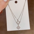 Silver double-layer clover bracelet featuring hollow and pavé zircon quatrefoil charms - Silver Zirconia Double Layer Clover Pendant Necklace