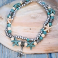 Multilayer anklet with starfish pendants and turquoise beads on a decorative shell - Smooth Sea Star