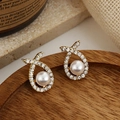 Elegant gold fish-shaped stud earrings with sparkling zircons and a white pearl accent - 73# Zircon Cross Pearl Studs