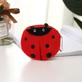 Plush ladybug coin purse in vibrant red with black polka dots and metal bead chain - Red Ladybug