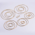 Polished gold stainless steel hoop earrings set in six sizes with snap closure - 15mm