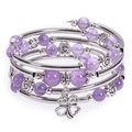 Macro detail of multi-layer beaded bracelet with purple stone beads and clover charm - Amethyst