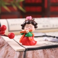 Detailed close-up of a Tang Dynasty style figurine girl playing a flute decor - Small Playing Flute Style (1056-2A)