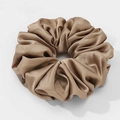 Oversized champagne satin scrunchie with a soft silk texture for elegant hairstyles - Tan