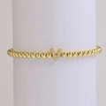 Golden bead stretch bracelet with a micro-pave zircon V letter pendant charm - Letter V