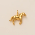 Polished 18K gold plated horse pendant detail showing smooth metal texture and top ring - Horse