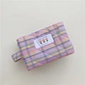 Close-up of quilted plaid makeup bag with Have a Nice Day label and zipper handle - Large Capacity Style / Pink Plaid