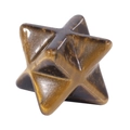 Detailed macro shot of natural tiger eye stone star with brown and gold polished texture - Tiger's Eye