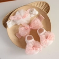 Detailed view of pink and white lace baby headbands with matching bow socks in a ceramic tray - 4646 Pink Dot Bow Headband + Socks