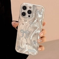 Detail of silver brushed texture iPhone case featuring a blue bowknot design - Silver Blue & Black Outlined Bow / iPhone 17 Air