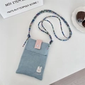 Detail of cute embroidered denim crossbody bag with rabbit pattern and colorful bead strap - Light Blue Rabbit