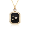Detailed macro view of a rectangular gold pendant with black inlay and sparkling stars - Black Starburst Rectangular Plate Style (E236)