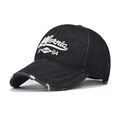 Detailed view of California 1984 embroidery and distressed edges on washed black denim cap - Adjustable / California Black