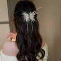 Detailed back view of gold butterfly hair claw clip with pearls and feathers on a model - 13# Golden Feather Butterfly Pearl Tassel Style