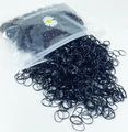 Bulk black disposable elastic hair ties spilling from a clear zipper pouch for girls - Black