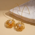 Detail of 18K gold plated hollow floral earrings with sparkling zircon crystal centers - Gold