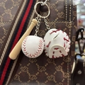 Mini baseball keychain with wooden bat and glove hanging on a stylish brown handbag - Full White with Red Strap Style / 3.50cm / White