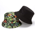 Reversible bucket hat with tropical plant print and solid black cotton fabric - Black Green Leaf