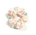 Detail of satin scrunchie with ladybug and floral print on cream background - White Colorful Dots