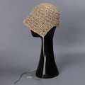 Detail of handwoven straw hat with light green ribbon tie on a display model - M(56-58cm) / Beige