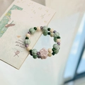 Handmade ceramic beaded bracelet featuring pink plum blossom and green pumpkin beads - Pink Flower (938A粉花)