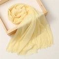 Soft yellow cotton linen scarf with elegant fringe trim placed in a wooden frame - 180*100cm / Light Yellow (TH39-29)