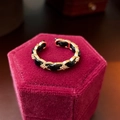 Macro shot of gold-plated chain ring with black leather inlay on red velvet - Open Adjustable (HR881) / Gold/Black