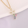 Detailed close-up of 18K gold letter Y crown pendant with colorful pavé cubic zirconia - Letter Y Style