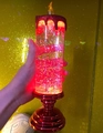 Handheld red glitter LED candle lamp with golden base and glowing liquid effect - Red Base